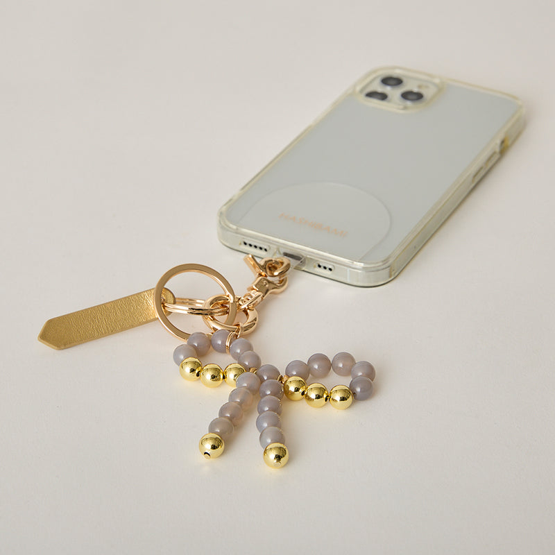 《予約販売》HASHIBAMI【Ha-2502-400 リボン天然石 スマホハンドストラップ】グレーオニキス